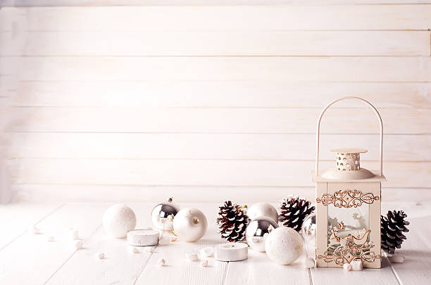 istock Burning lantern in the snow with christmas decoration 611759634