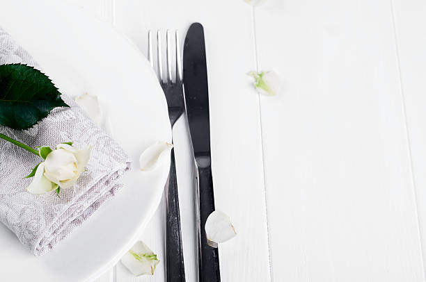 istock Served plate with napkin and rose close-up 611759854