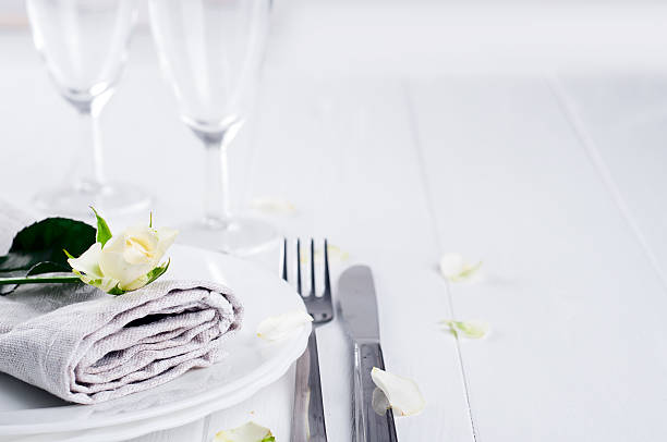 istock Served plate with napkin and rose close-up 611759934