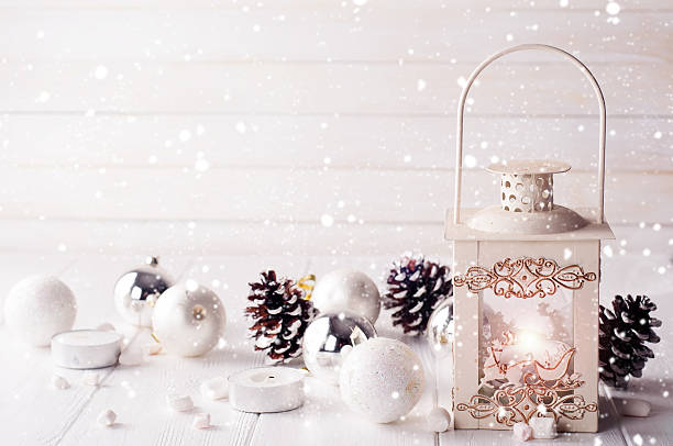 istock Burning lantern in the snow with christmas decoration 611760654