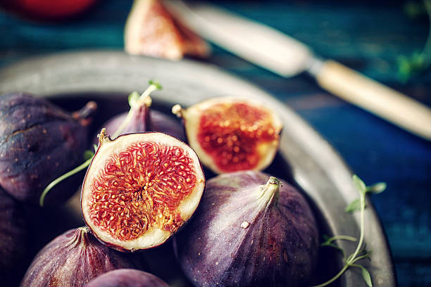 Figs and Sweet Honey on Wooden Background Figs and Sweet Honey on Wooden Background fig photos stock pictures, royalty-free photos & images