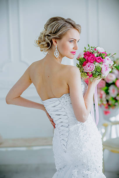 istock Beautiful Bride portrait wedding makeup and hairstyle with diamond crown 611761928
