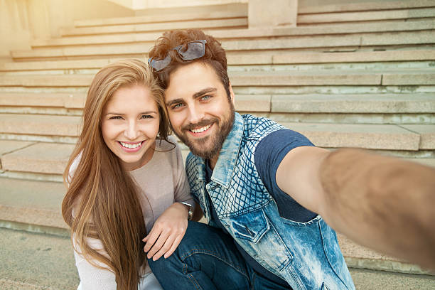 istock Young couple makes his selfie 611762170