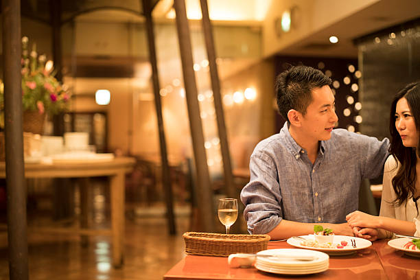 istock Couples dating in the modern restaurant 611765072
