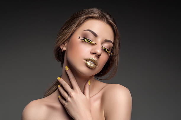 Young Woman Wearing Gold Face Paint And Lace Stock Photo - Download Image  Now - Gold Colored, Fashion, Human Lips - iStock