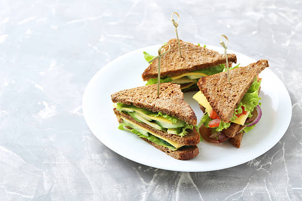 istock Tasty and fresh sandwiches on a grey table 611766364