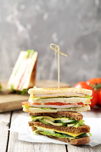 istock Tasty and fresh sandwiches on a grey wooden table 611766432