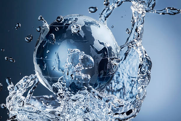istock glass globe planet in drop water splash on blue background 611767072