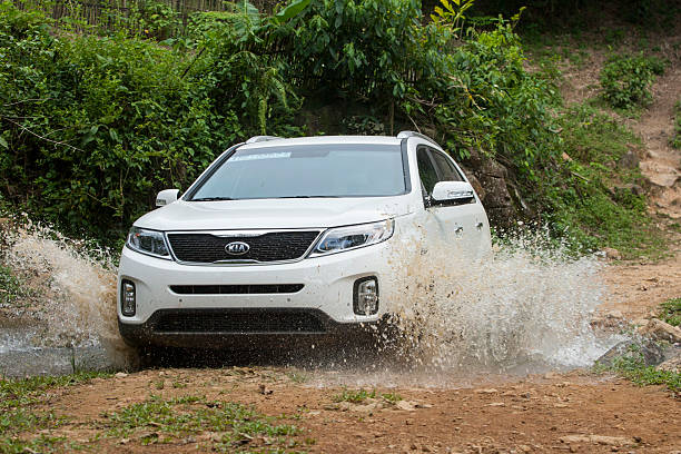 Kia New Sorento car Hoabinh, Vietnam - Jun 4, 2014: Kia New Sorento car is running on the mountain road in test drive, Vietnam. cross off stock pictures, royalty-free photos & images