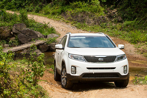 Kia New Sorento car Hoabinh, Vietnam - Jun 3, 2014: Kia New Sorento car is running on the mountain road in test drive, Vietnam. cross off stock pictures, royalty-free photos & images