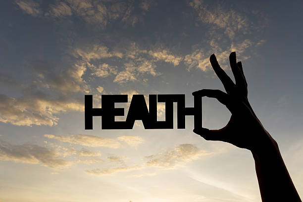 istock Health word being held against sky 611768696