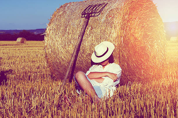 istock Young farmer sitting on field 611768774