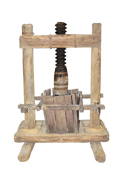 istock Ancient wooden wine press isolated on white background 611768780