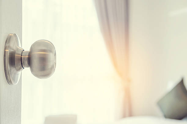 istock half-open door of a bedroom 611770592