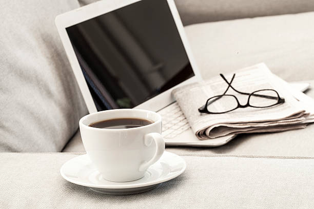 istock Eyeglasses on laptop and coffee 611773476
