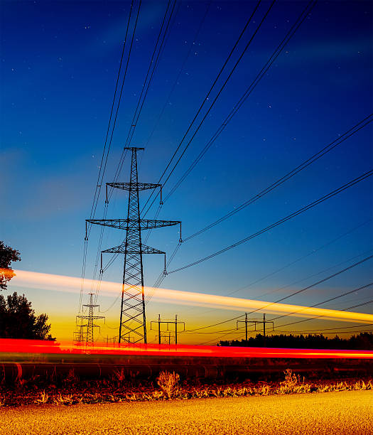 istock Long Exposure Red Car light trails on a road 611774696