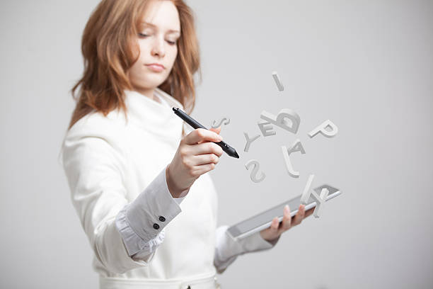 istock Woman working with a set of letters, writing concept. 611776832
