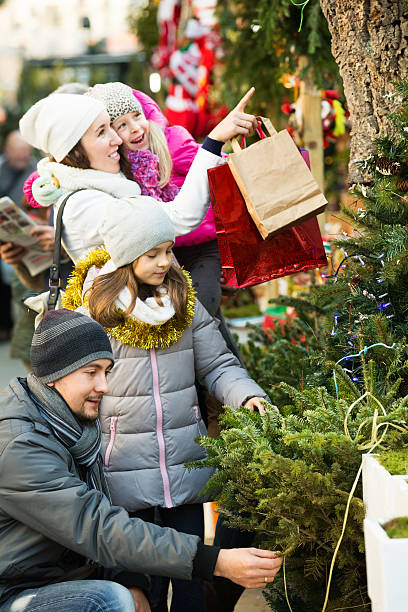 istock Family choosing Christmas tree 611777968