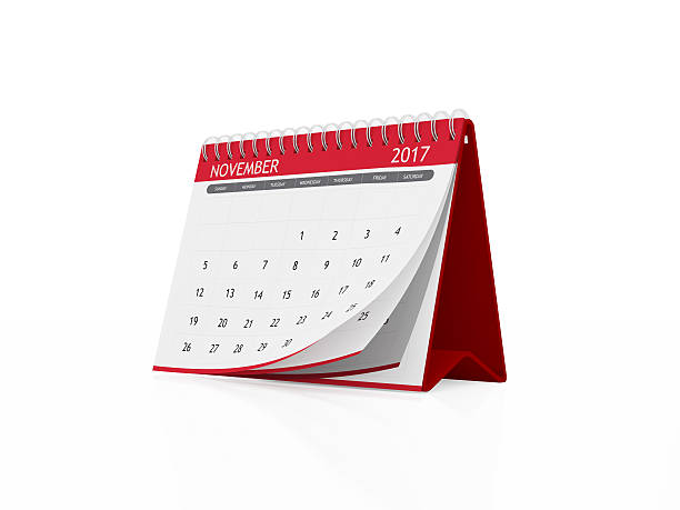 istock November 2017 Red Plastic Framed Desktop Calendar on White Backg 611782332