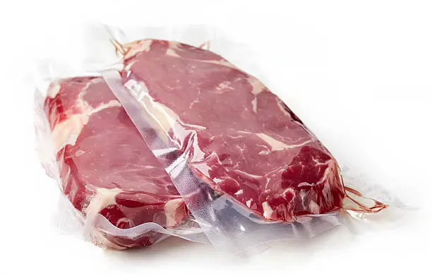 Photo of Fresh beef steak for sous vide cooking, isolated on white