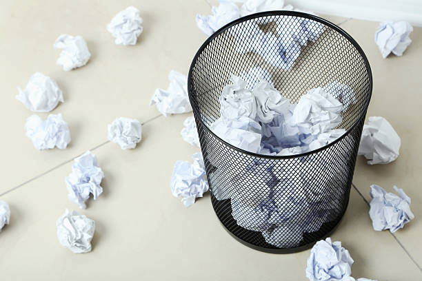 istock Office trashcan with crumpled paper balls 611783260