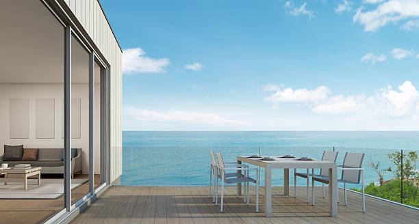 istock Outdoor dining, Beach house with sea view in modern design 611783968