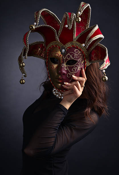istock Beautiful woman with carnival mask 611784120