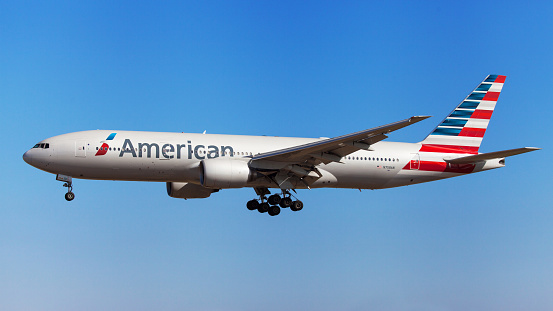 Barcelona, Spain - August 22, 2016: American Airlines Boeing 777-200ER approaching to El Prat Airport in Barcelona, Spain.