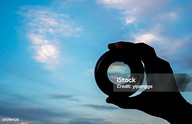 Hand Holding Lens Watching Cloudscape Stock Photo - Download Image Now - Telescope, Focus - Concept, Image Focus Technique