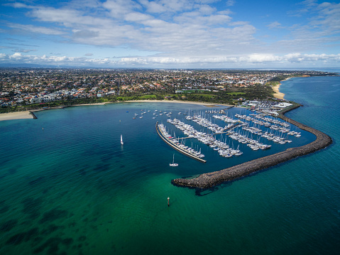 Aerial image of Sandringham Marina and Yacht Club with suburban landscape in the background. Melbourne, Victoria, Australia