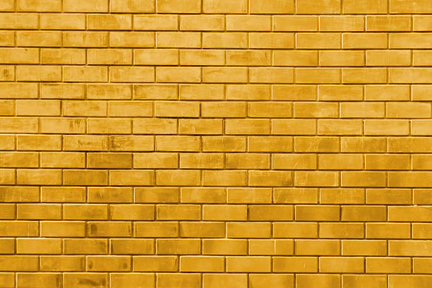 Yellow gold brick wall abstract texture background stock photo