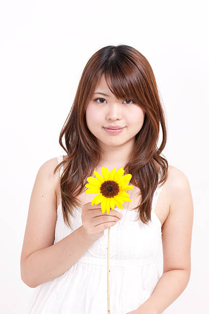 istock Woman holding a sunflower 611787922