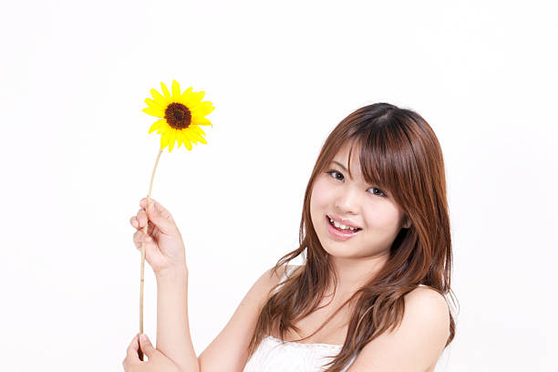 istock Woman holding a sunflower 611788014