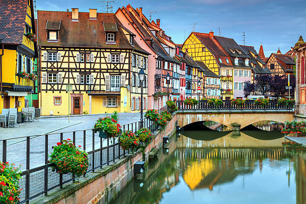 istock Typical medieval half-timbered facades reflecting in water,Colmar,France 611788532