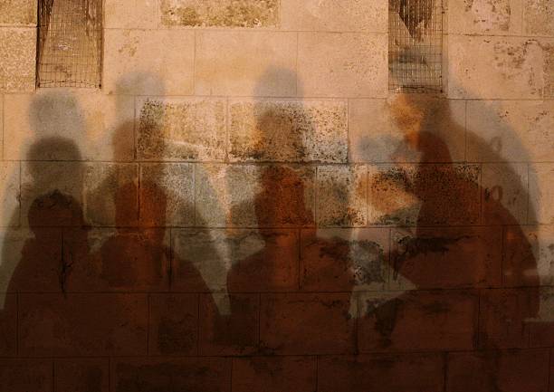 istock Four men conversing in the shade 611788904