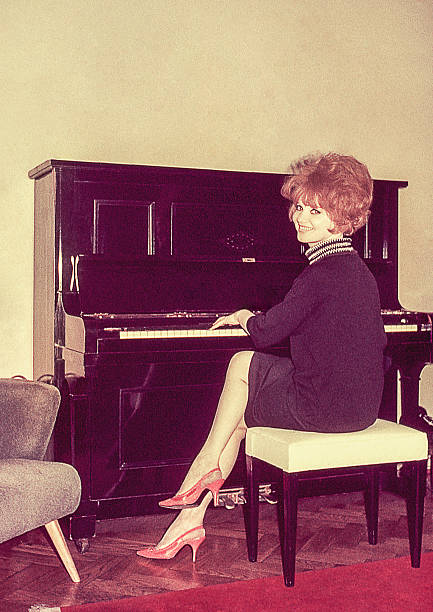 Woman from the sixties playing piano