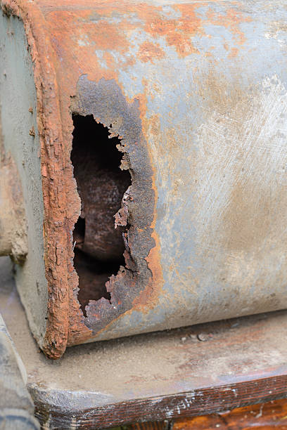 istock Old car muffler. Front and corrosion damage. 611790460
