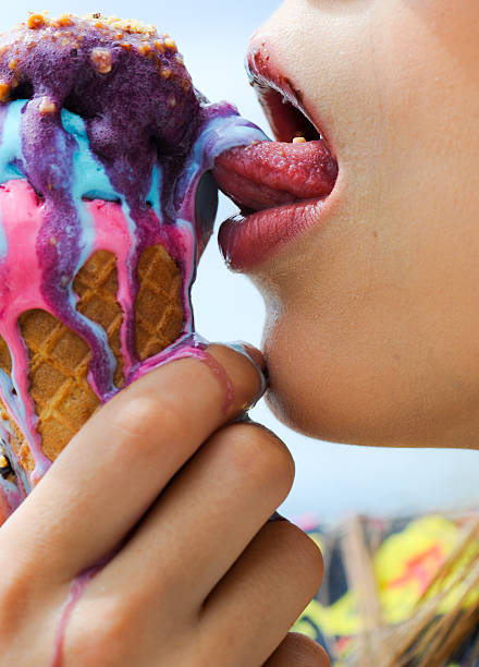 istock Young real woman eating ice cream 611790760