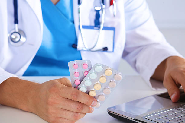istock doctor in the Office makes an entry 611790976