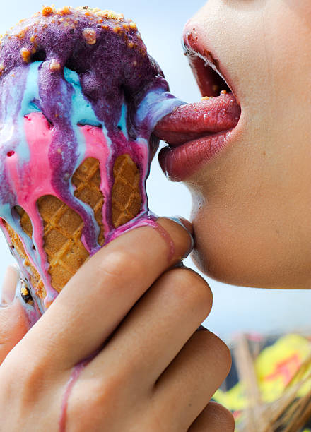 istock Young real woman eating ice cream 611791074