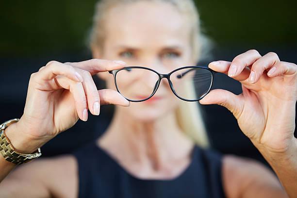 istock Pair of glasses in black frame 611856824