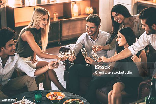 Cheers To Friends Stock Photo - Download Image Now - Celebratory Toast, Dinner Party, Party - Social Event