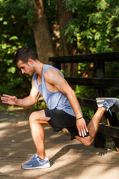 istock Athlete doing stretching in morning at park 611859228