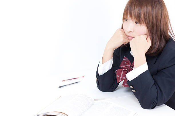 istock Japanese schoolgirl studying 611859262
