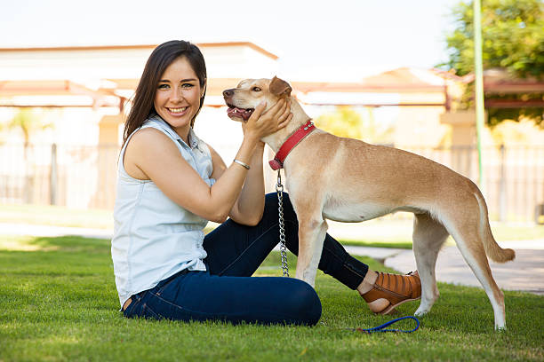istock Cute girl hanging out with her dog 611859892