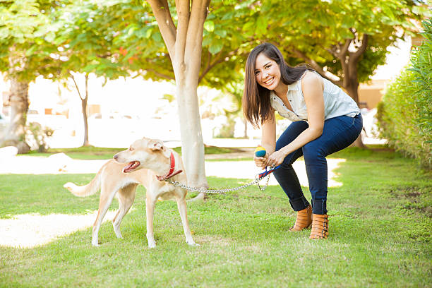 istock Happy woman playing with her dog 611860158