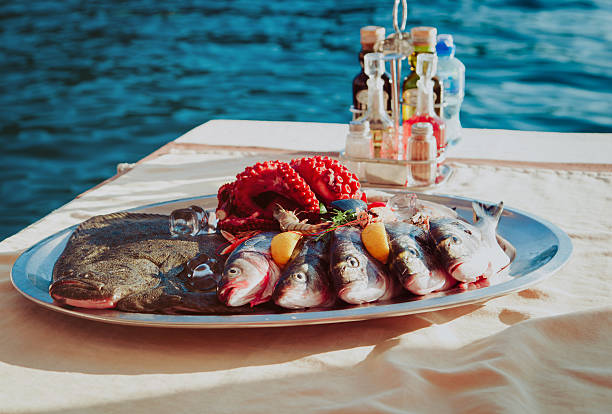 istock fresh seafood plate in restaurant at sea 611861702