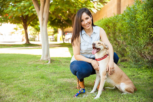 istock Beautiful woman with a dog 611862744
