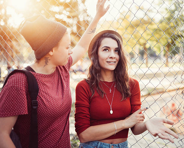 istock Lesbian couple flirting outside 611863196
