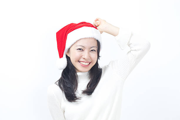 istock Woman wearing a santa hat 611864744